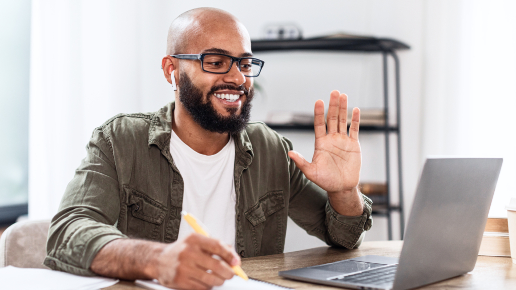 Business owner waving to clients who opted in for his email marketing.