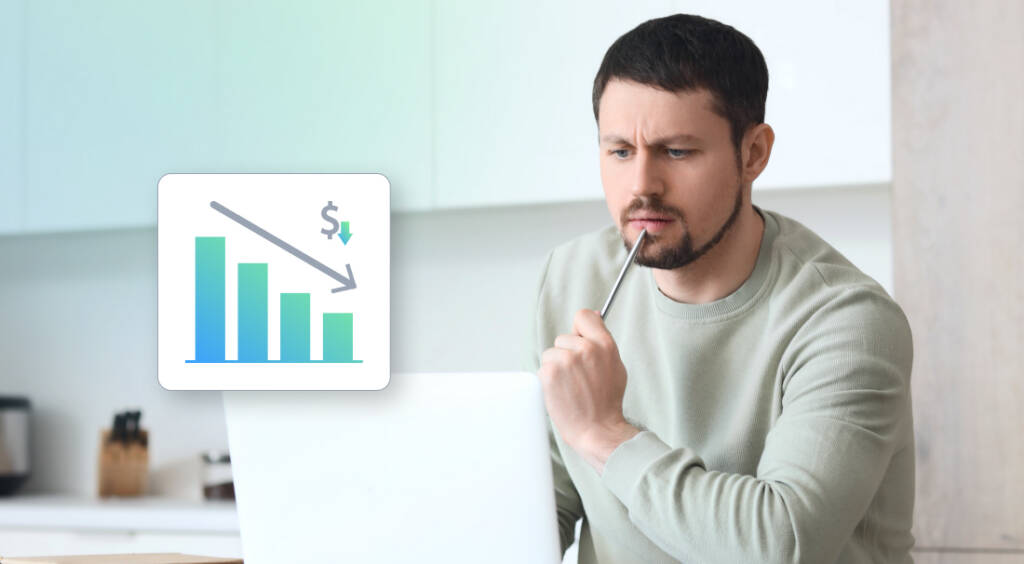 Man looking at his laptop screen, thinking if he should lower his price point.